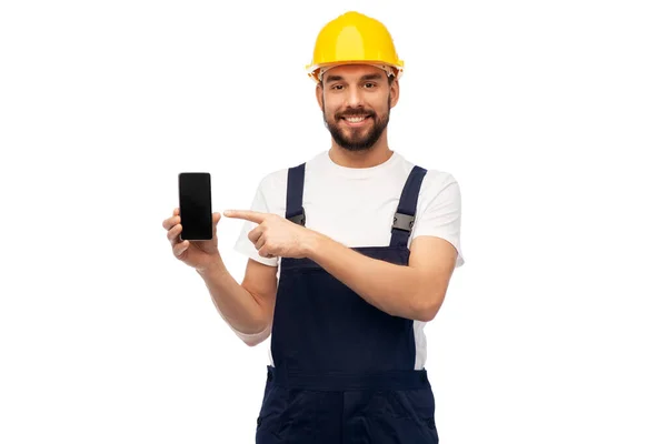 Trabajador masculino feliz o constructor mostrando teléfono inteligente —  Fotos de Stock