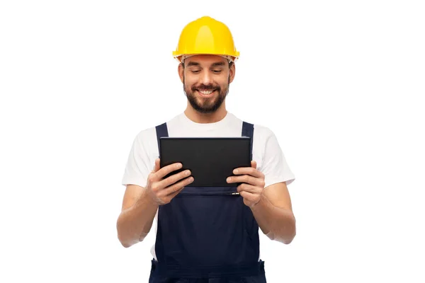 Šťastný muž pracovník nebo stavitel s tabletovým počítačem — Stock fotografie