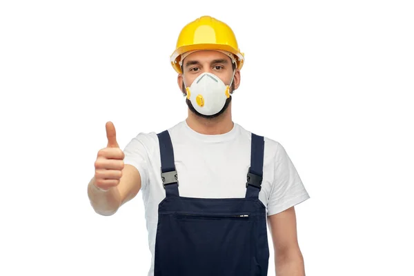 Male worker or builder in helmet and respirator — Stock Photo, Image