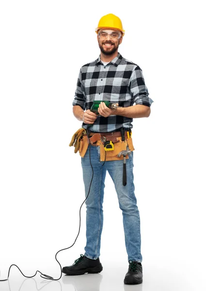 Gelukkig mannelijk arbeider of bouwer in helm met boor — Stockfoto