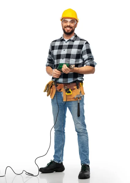 Happy male worker or builder in helmet with drill — Stock Photo, Image