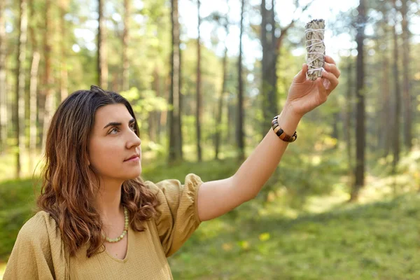 Woman or witch performing magic ritual in forest — Stock Photo, Image