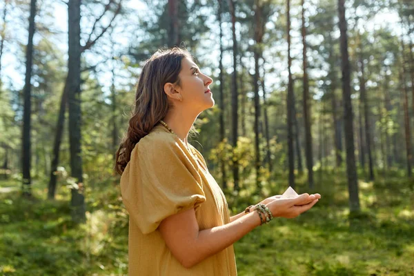 Young woman or witch holding pyramid in forest — Stock Photo, Image