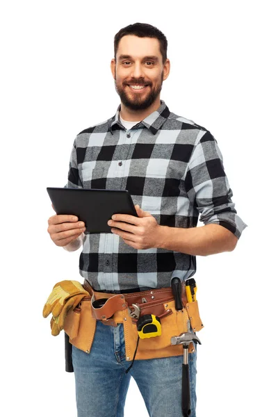 Construtor feliz com computador tablet e ferramentas — Fotografia de Stock