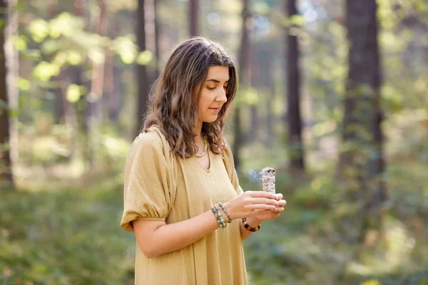 Woman or witch performing magic ritual in forest — Stock Photo, Image