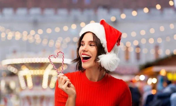 Happy young woman in santa hat on christmas — Stock Photo, Image