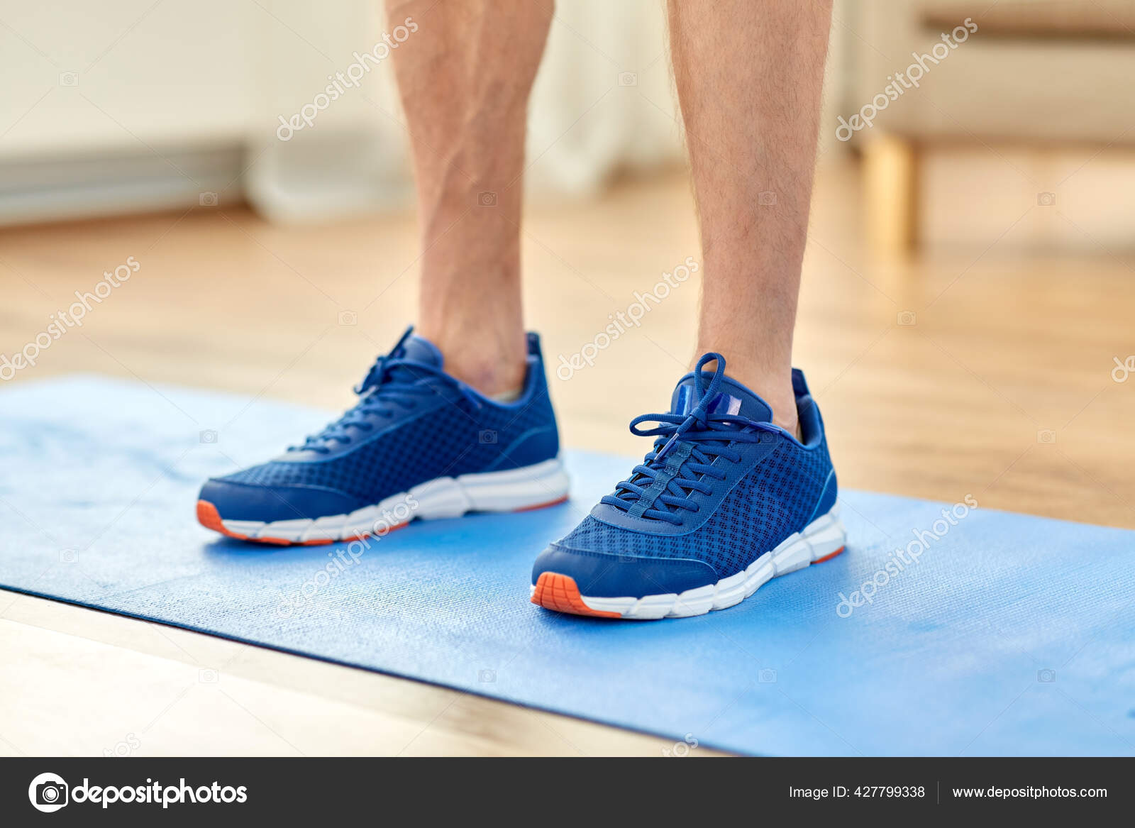 Close up of male feet in sneakers on exercise mat Stock Photo by  ©Syda_Productions 427799338