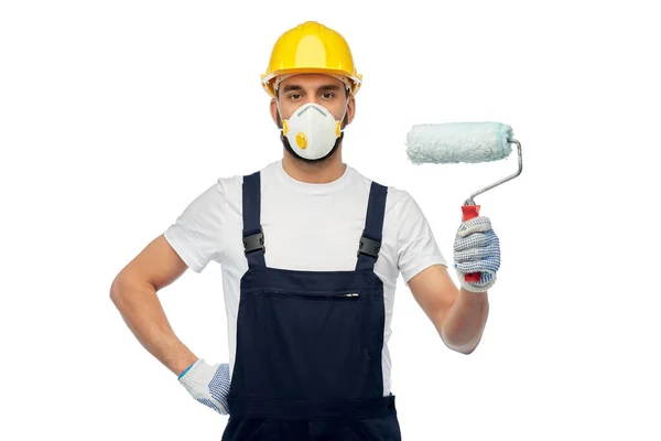 Arbetare eller byggare i respirator med färg roller — Stockfoto