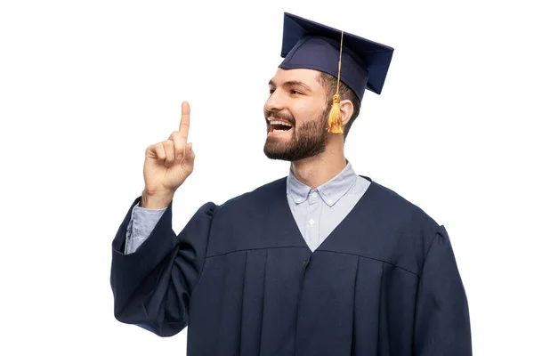 Happy graduate student pointing his finger up — Stock Photo, Image