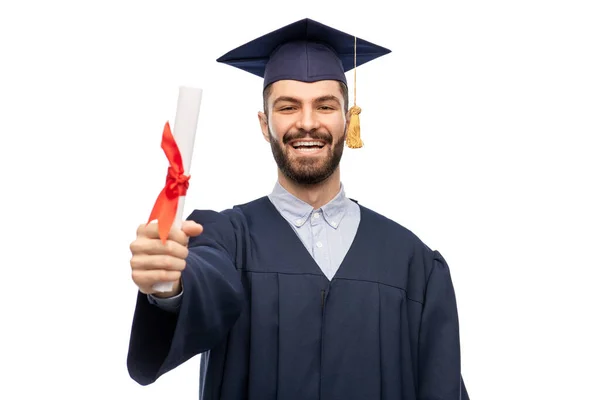 Male graduate student in mortar board with diploma — Stock Photo, Image