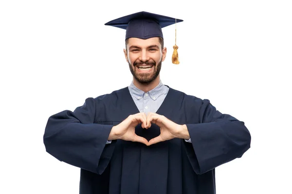 Estudiante graduado o soltero mostrando el corazón de la mano —  Fotos de Stock
