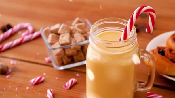 Glass mug of eggnog, ingredients and sweets — Stock Video