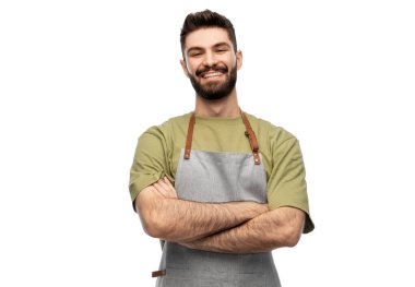happy smiling barman in apron with crossed arms clipart