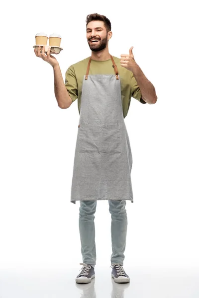 Happy waiter with takeout coffee showing thumbs up — Stock Photo, Image