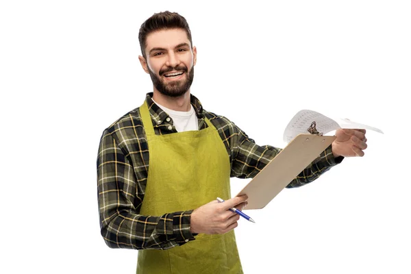 Gelukkig mannetje tuinman met klembord — Stockfoto