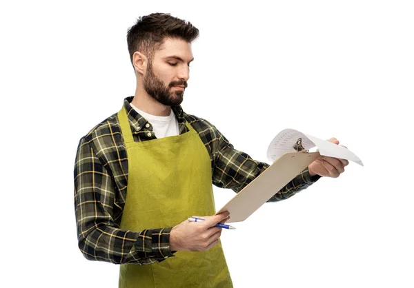 Male gardener with clipboard and papers — Stock Photo, Image