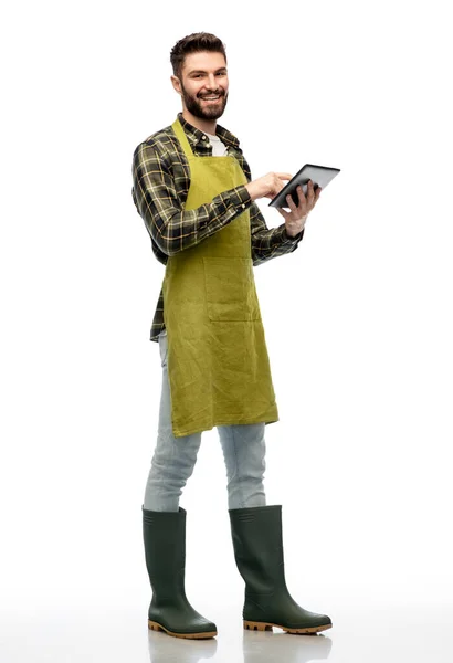 Happy male gardener or farmer with tablet pc — Stock Photo, Image