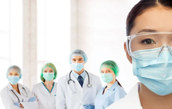 Asian female doctor in medical mask at hospital Stock Picture