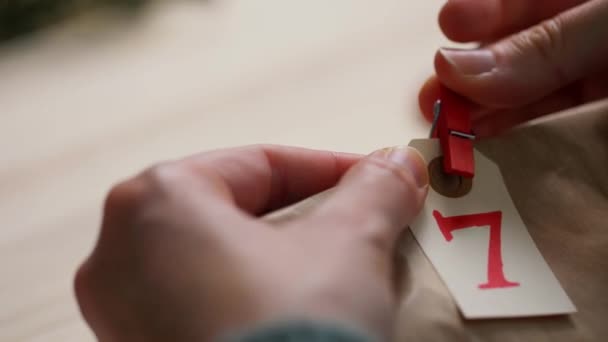 Hands making advent calender on christmas at home — Stock Video