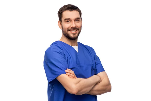 Feliz médico sonriente o enfermero en uniforme azul —  Fotos de Stock