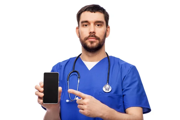 Doctor or male nurse with smartphone — Stock Photo, Image