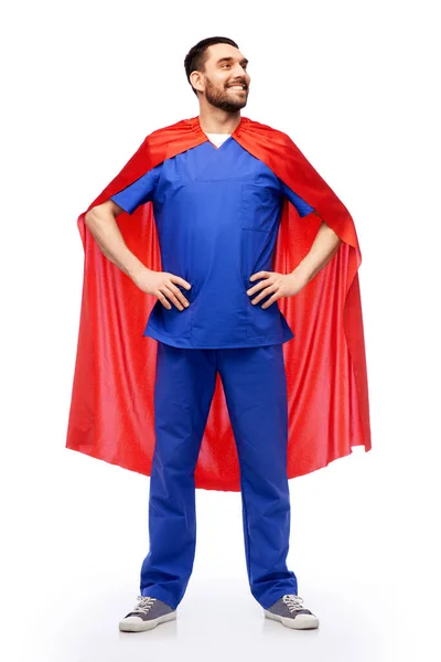 Smiling doctor or male nurse in superhero cape — Stock Photo, Image