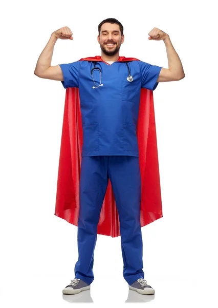 Smiling doctor or male nurse in superhero cape — Stock Photo, Image