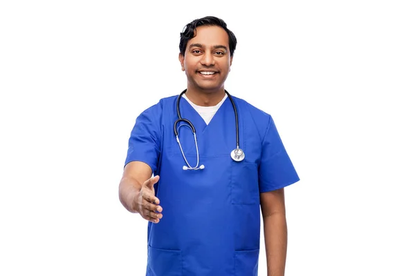 Happy indian male doctor giving hand for handshake — Stock Photo, Image