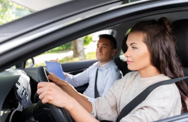 car driving school instructor and young driver