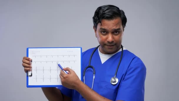 Doctor with cardiogram having video conference — Stock Video