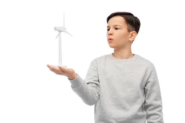 Boy with toy wind turbine Stock Photo