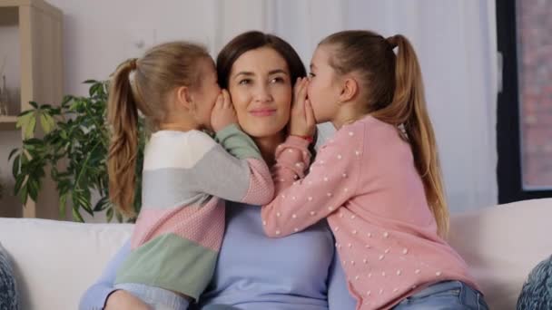 Happy mother and daughters gossiping at home — Stock Video