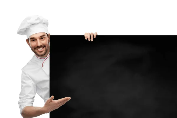 Feliz sorrindo chef masculino com grande quadro preto — Fotografia de Stock