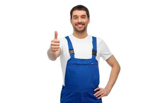 Happy male worker or builder showing thumbs up — Stock Photo, Image