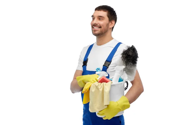 Male cleaner in overall with cleaning supplies — Stock Photo, Image