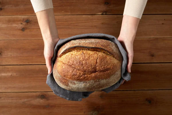 Female baker with homemade bread at bakery — Stock Photo, Image