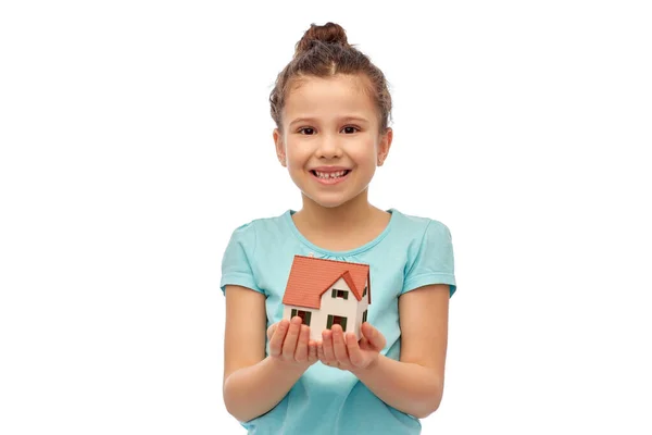 Smiling girl holding house model — Stock Photo, Image