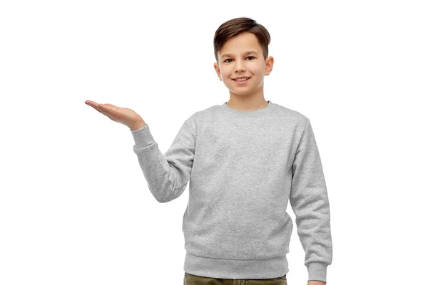 Happy boy holding something imaginary on hand — Stock Photo, Image