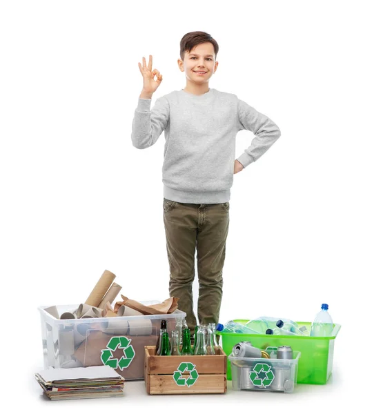 Smiling boy sorting paper, metal and plastic waste — Stock Photo, Image