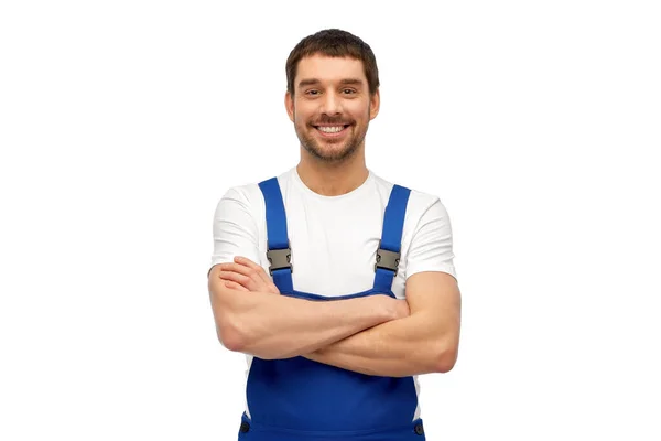 Happy smiling male worker or builder in overall — Stock Photo, Image