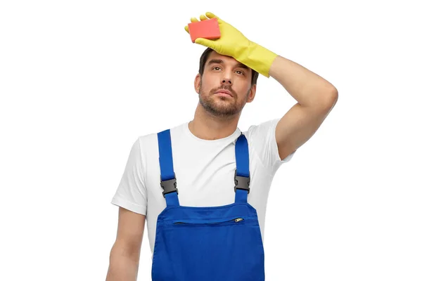 Tired male cleaner with sponge — Stock Photo, Image