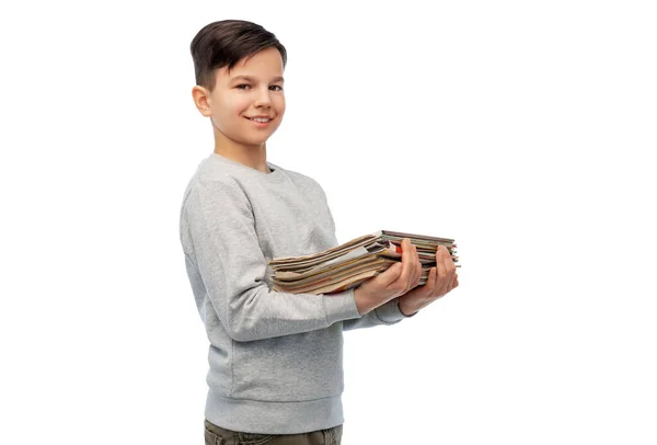 Smiling boy with magazines sorting paper waste — Stock Photo, Image