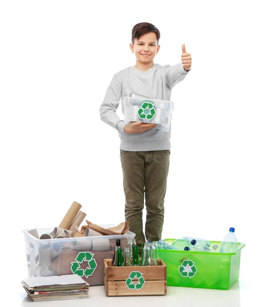 Smiling boy sorting paper, metal and plastic waste — Stock Photo, Image