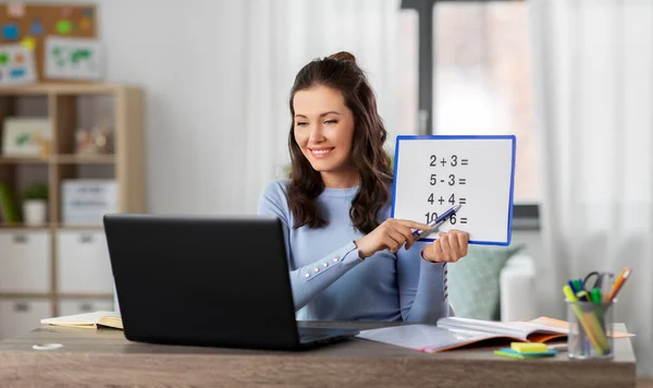 Math teacher having online class at home — Stock Photo, Image