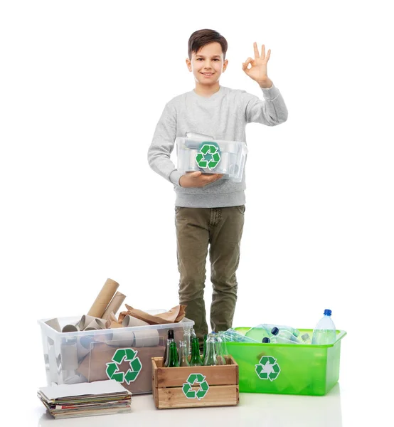 Smiling boy sorting paper, metal and plastic waste — Stock Photo, Image