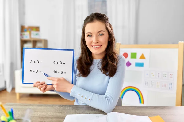 Math teacher having online class at home — Stock Photo, Image