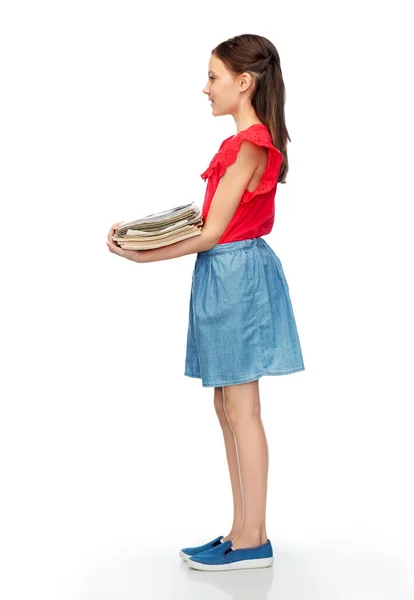 Smiling girl with magazines sorting paper waste — Stock Photo, Image