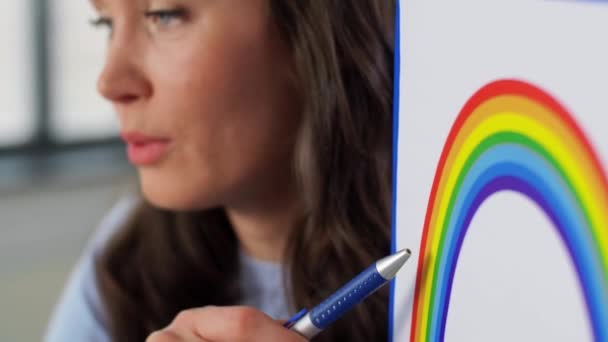Teacher with rainbow having online class at home — Stock Video