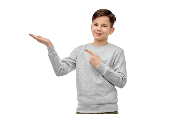 Happy boy holding something imaginary on hand — Stock Photo, Image