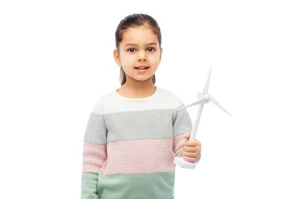 Smiling girl with toy wind turbine — Stock Photo, Image